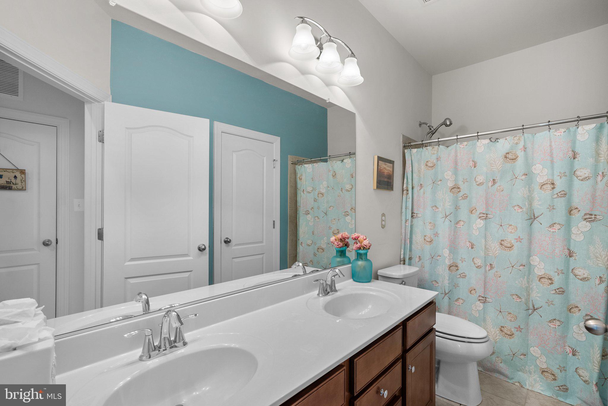 161 Moore Road Arnold, MD 21012 - Photo 33 of 57 a bathroom with a sink toilet and shower