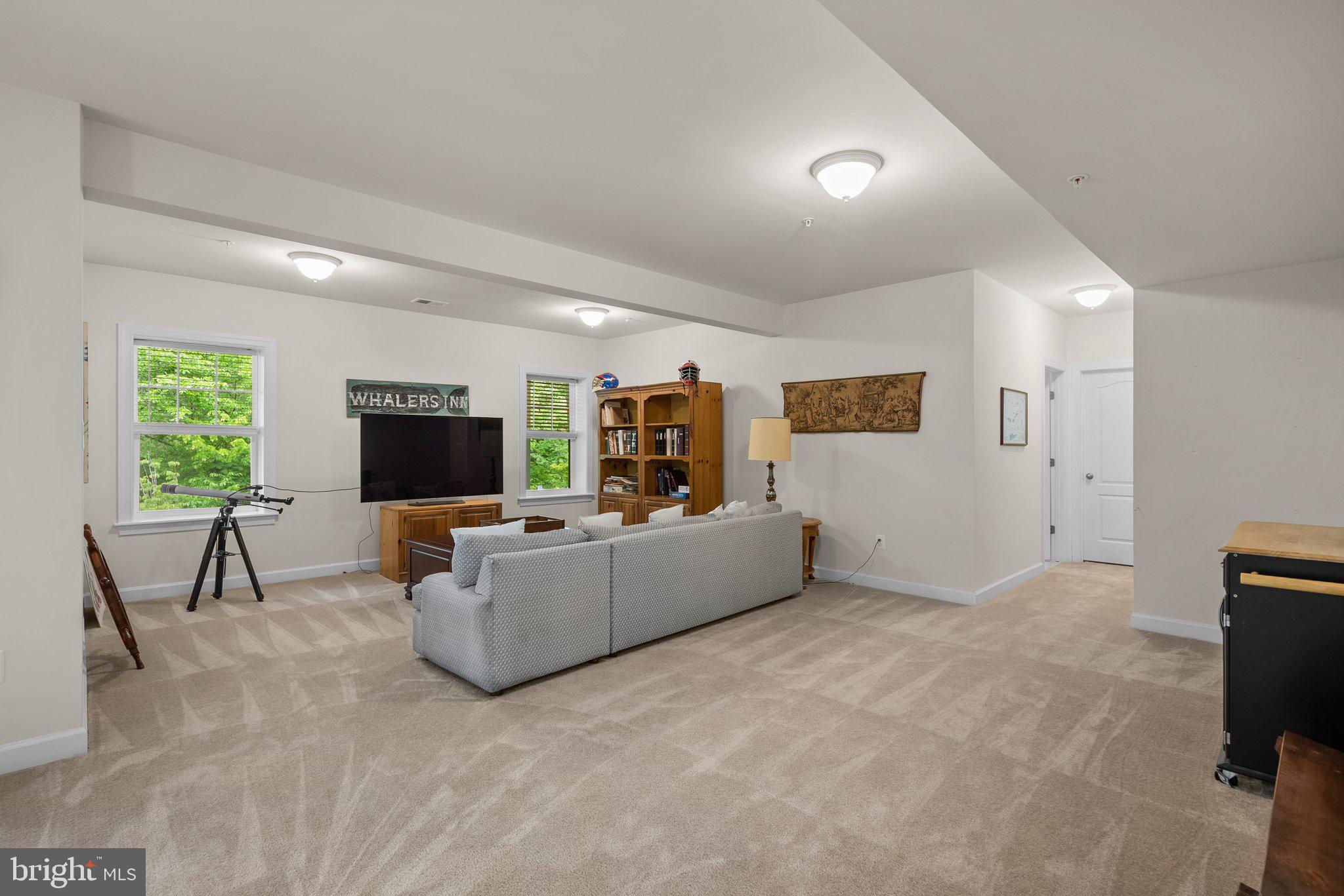 161 Moore Road Arnold, MD 21012 - Photo 38 of 57 a living room with furniture and a flat screen tv