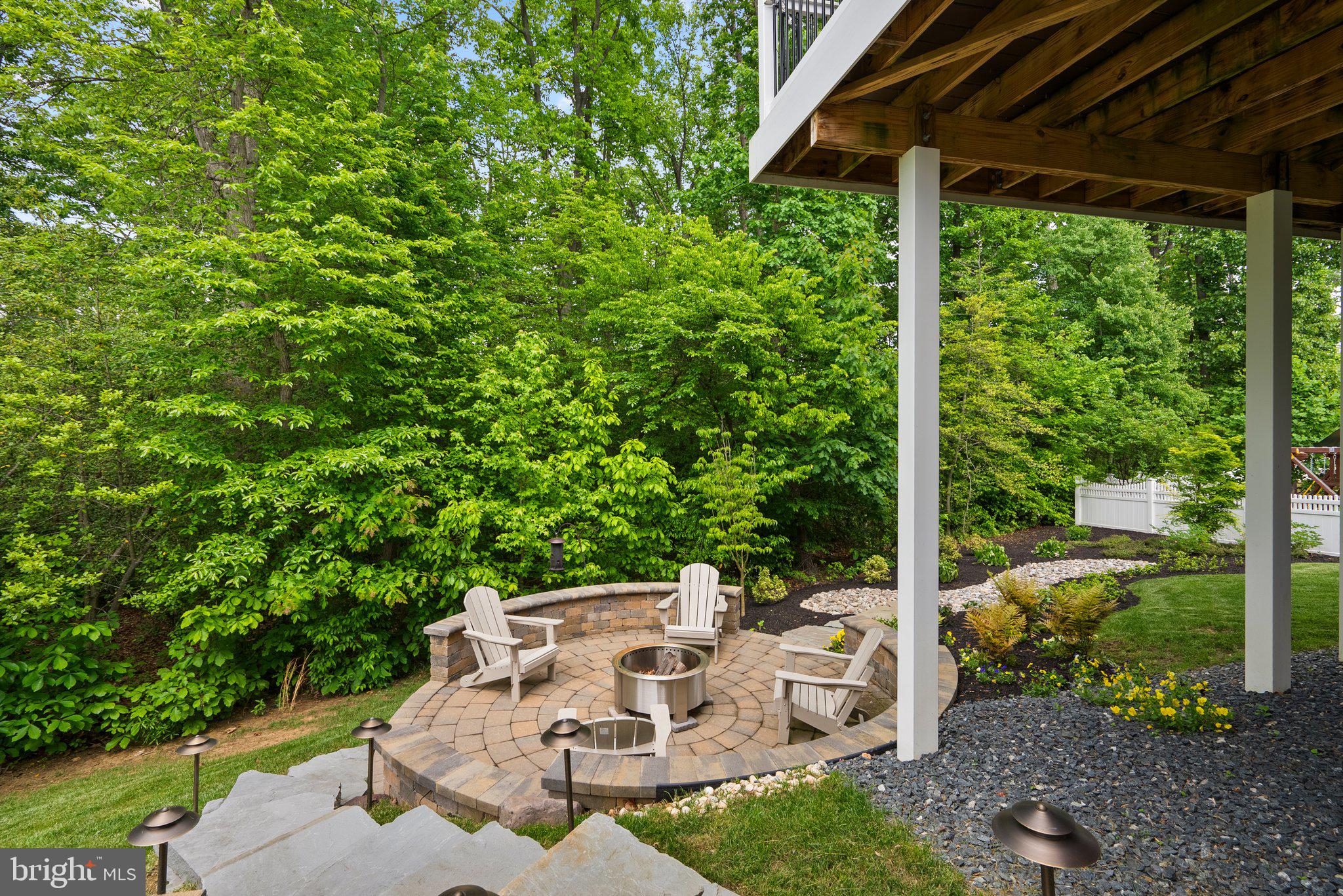 161 Moore Road Arnold, MD 21012 - Photo 47 of 57 a view of a patio with table and chairs potted plants with wooden floor and fence