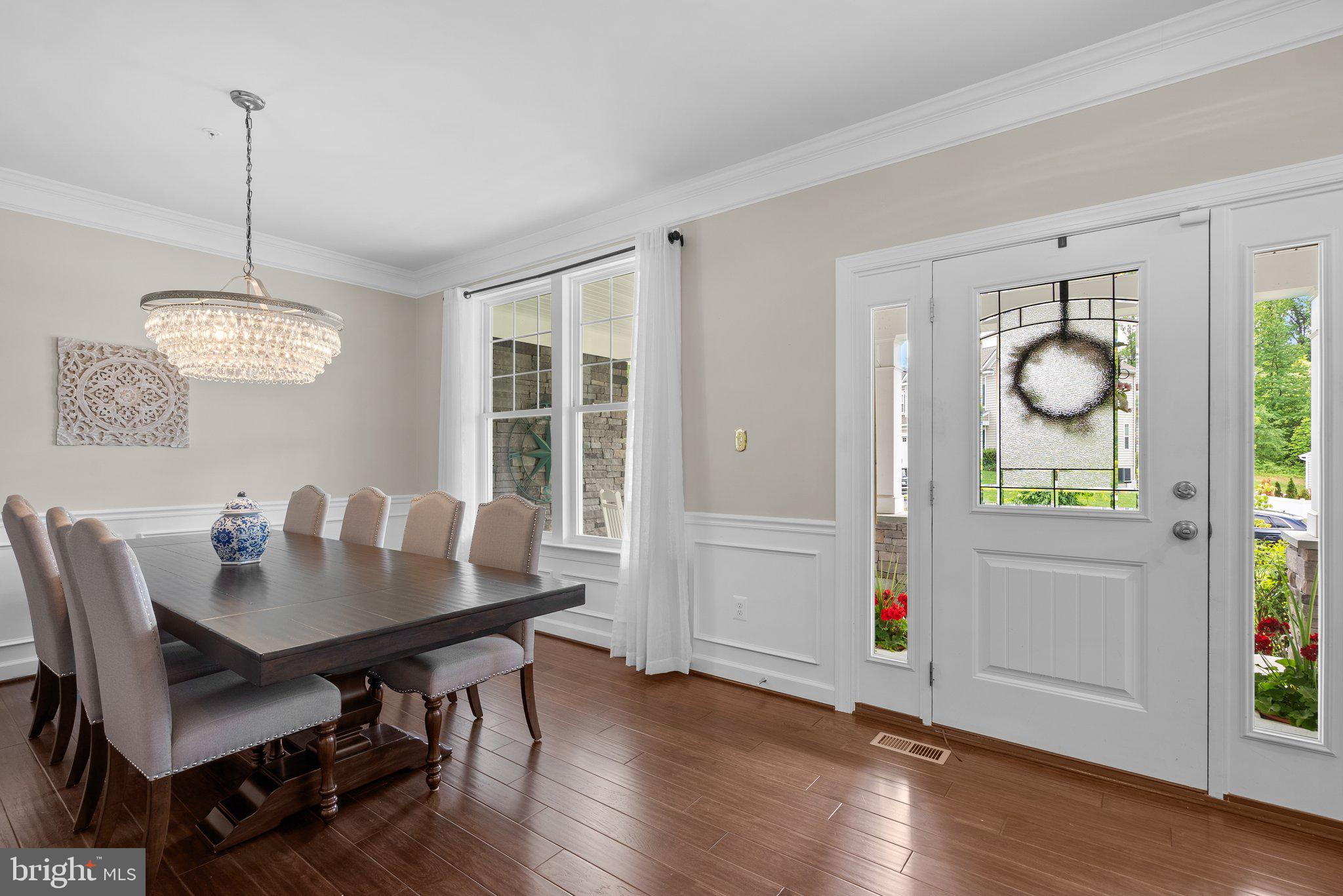 161 Moore Road Arnold, MD 21012 - Photo 7 of 57 a view of a dining room with furniture window and wooden floor