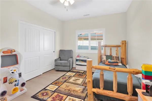 a bedroom with furniture and a window