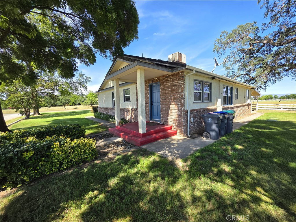 23773 River Road Corning, CA 96021 - Photo 28 of 64 a view of a house with a yard and tree s