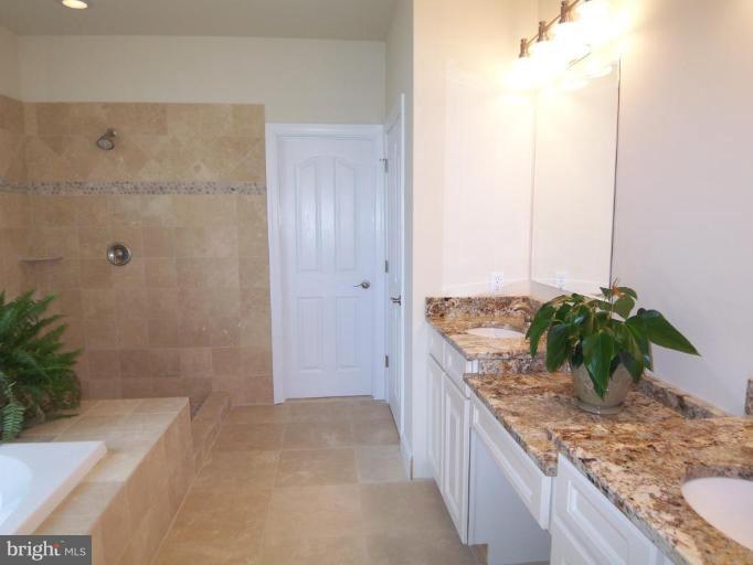 20047 Middletown Road Freeland, MD 21053 - Photo 14 of 25 a bathroom with a granite countertop sink and a mirror