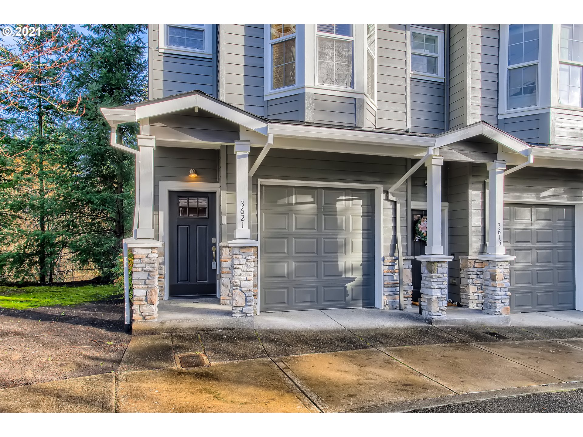 3621 Southwest Innovation Court Beaverton, OR 97003 - Photo 2 of 32 a front view of a house with a yard and garage