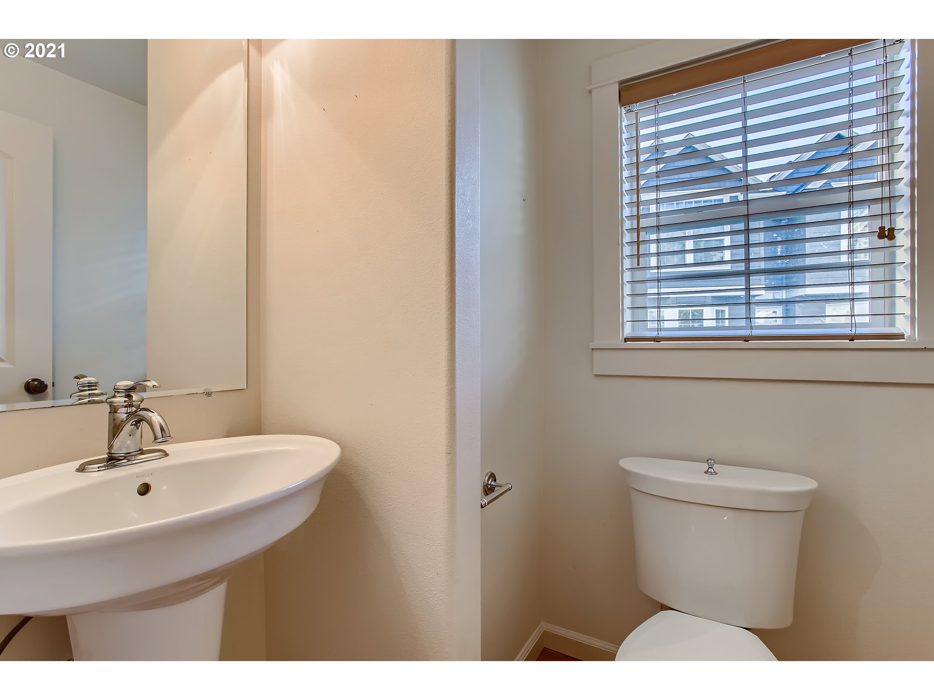 3621 Southwest Innovation Court Beaverton, OR 97003 - Photo 14 of 32 a bathroom with a sink a toilet and a mirror