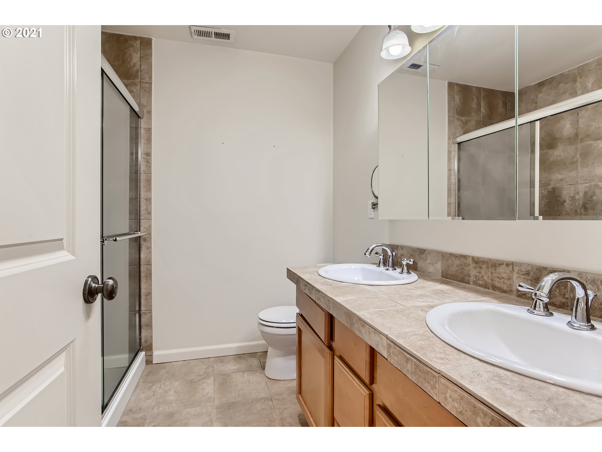 3621 Southwest Innovation Court Beaverton, OR 97003 - Photo 18 of 32 a bathroom with a sink toilet a mirror and shower