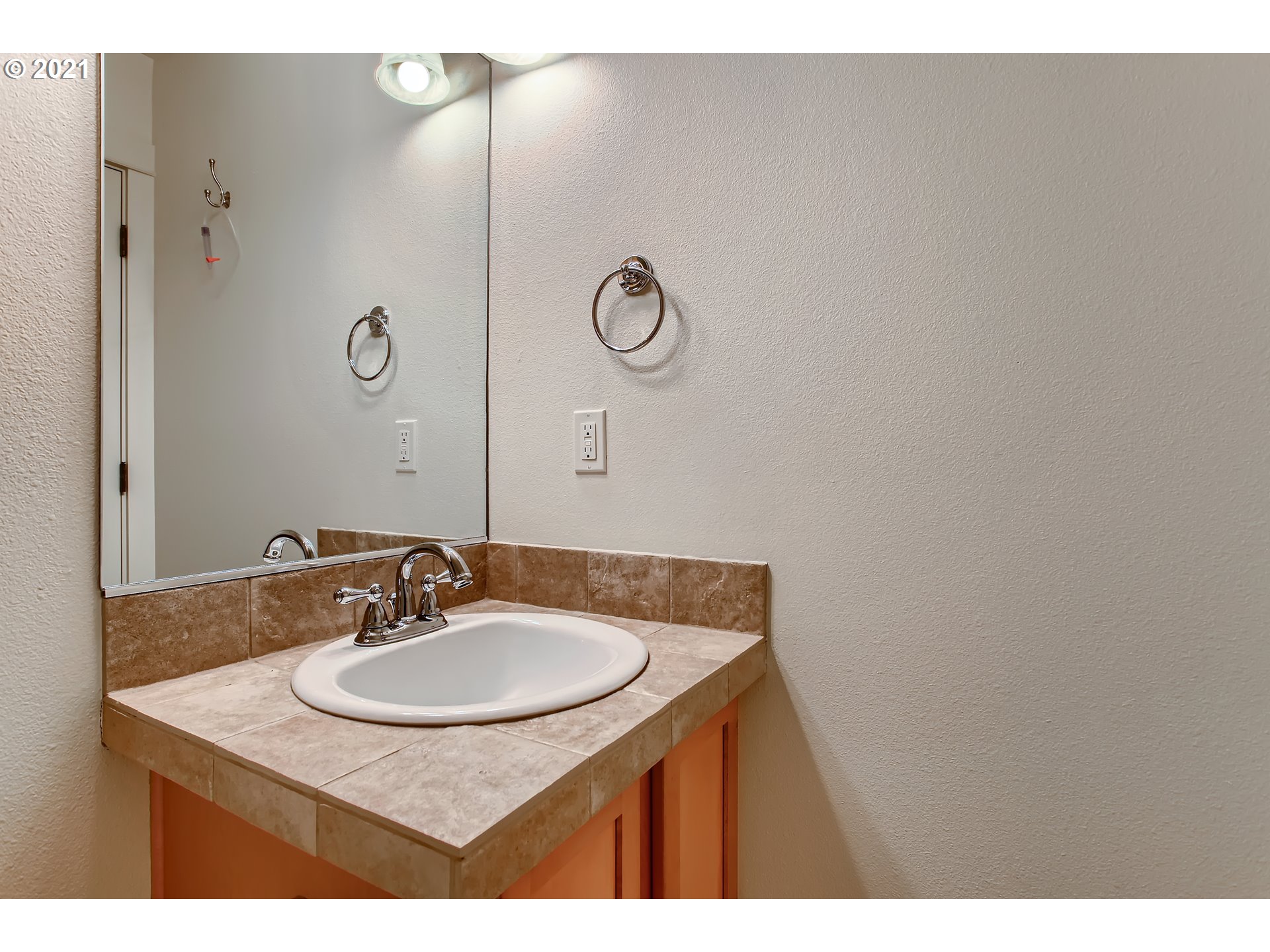 3621 Southwest Innovation Court Beaverton, OR 97003 - Photo 22 of 32 a bathroom with a sink and a mirror