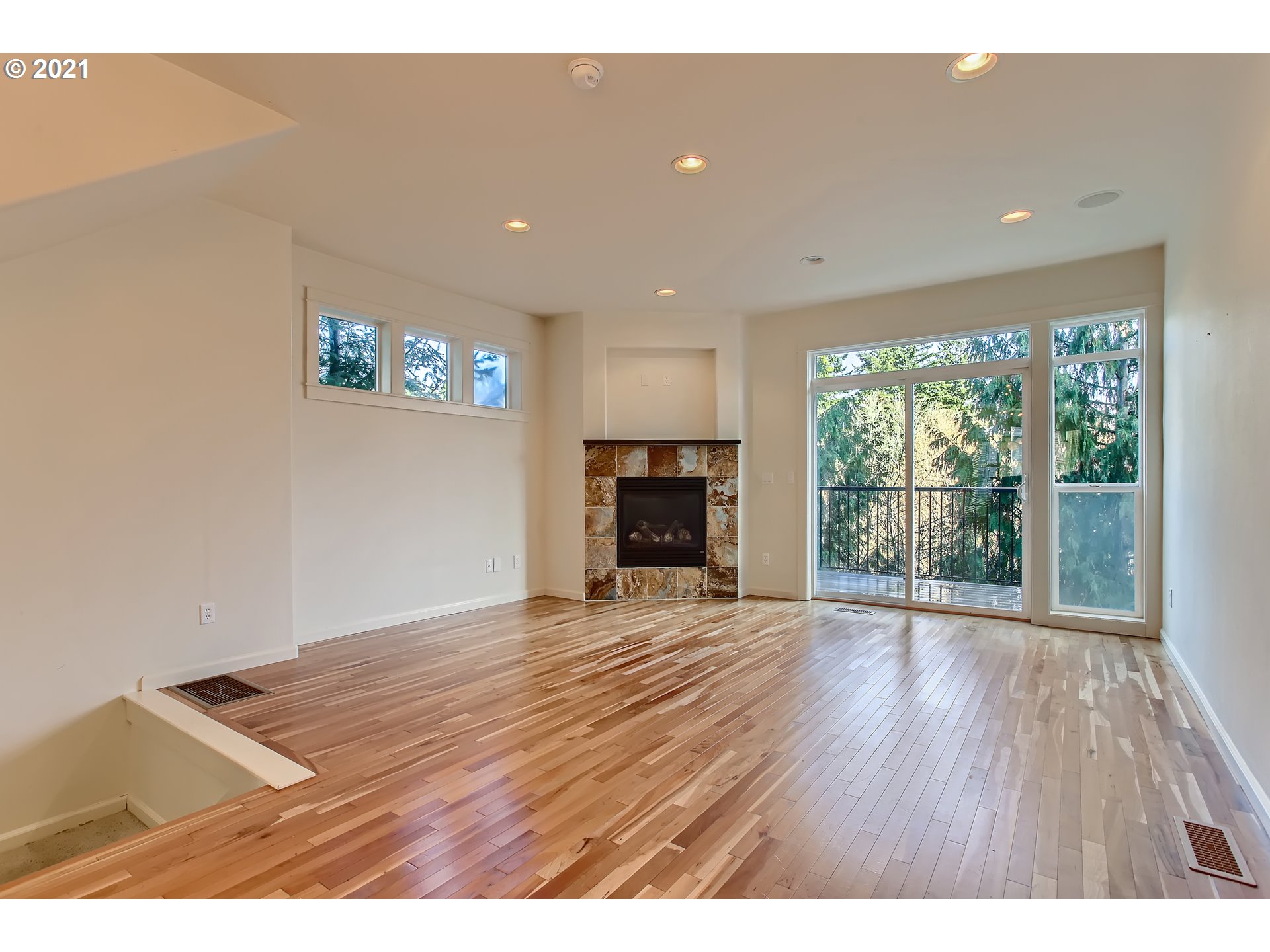 3621 Southwest Innovation Court Beaverton, OR 97003 - Photo 5 of 32 a view of empty room with wooden floor and fireplace
