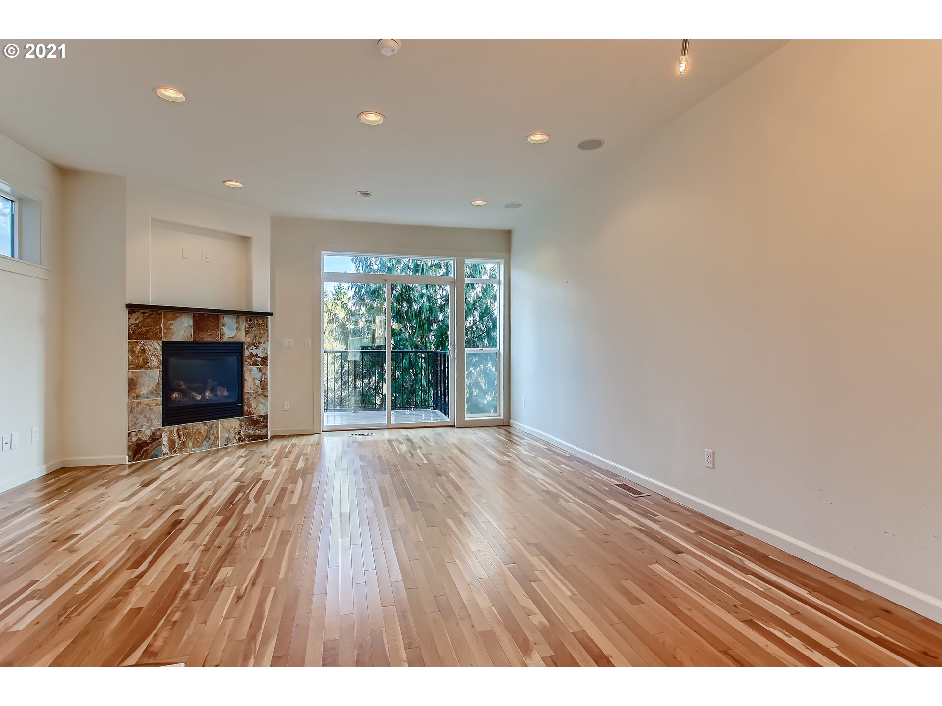 3621 Southwest Innovation Court Beaverton, OR 97003 - Photo 6 of 32 a view of an empty room with wooden floor and a window