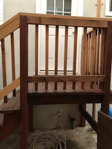 a view of a small yard from a balcony