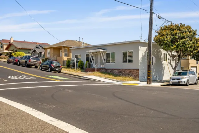 a view of a building with a street