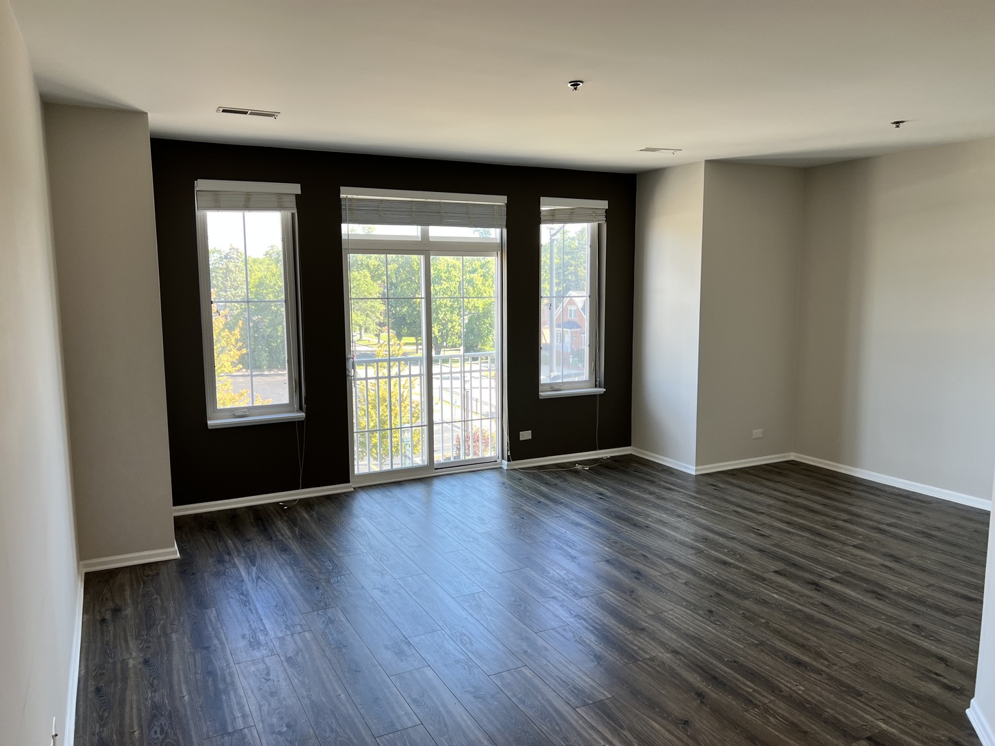 625 Deerfield Road, Unit 307 Deerfield, IL 60015 - Photo 5 of 12 an empty room with wooden floor and windows