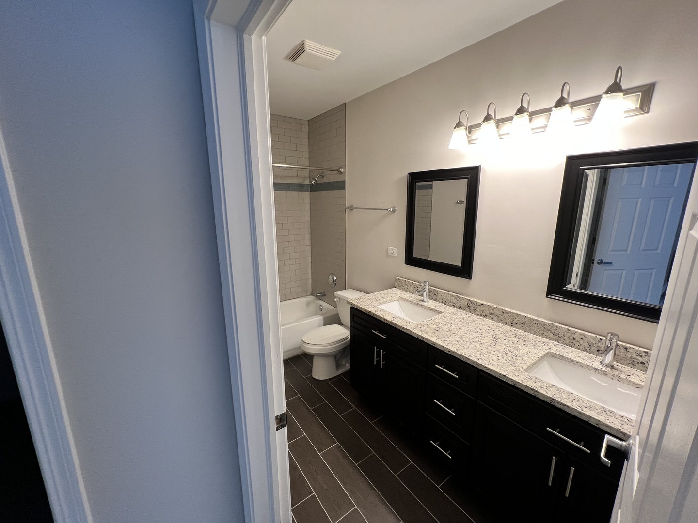 625 Deerfield Road, Unit 307 Deerfield, IL 60015 - Photo 8 of 12 a bathroom with a double vanity sink and a mirror