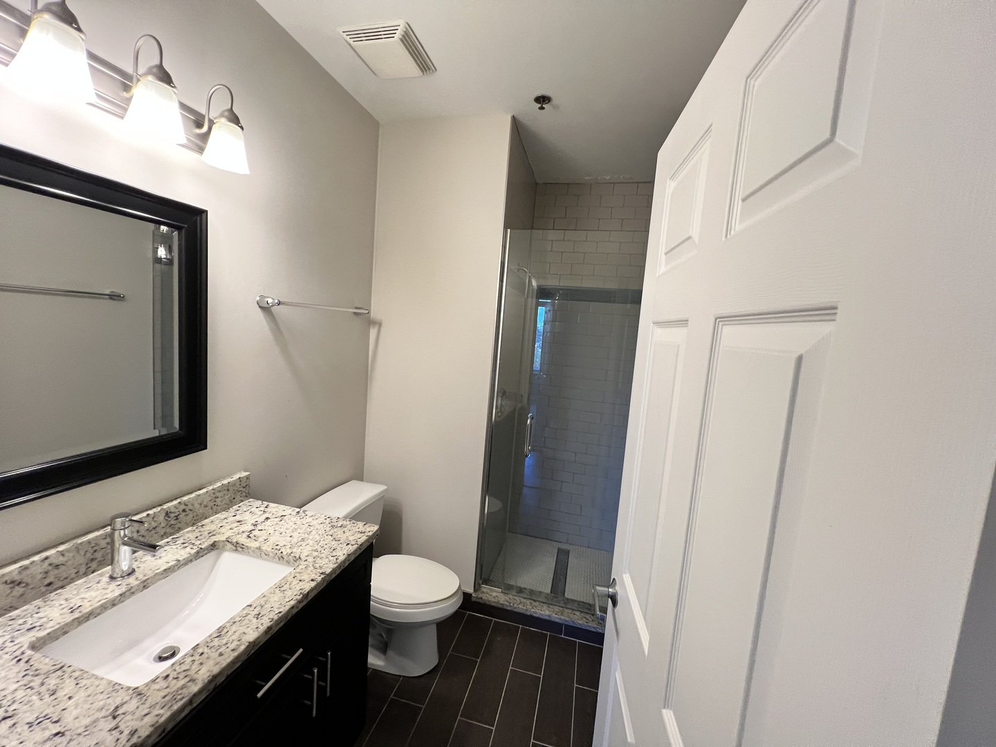 625 Deerfield Road, Unit 307 Deerfield, IL 60015 - Photo 10 of 12 a bathroom with a granite countertop sink toilet and shower