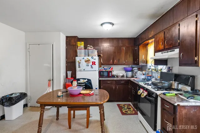 a bathroom with a sink toilet and a mirror