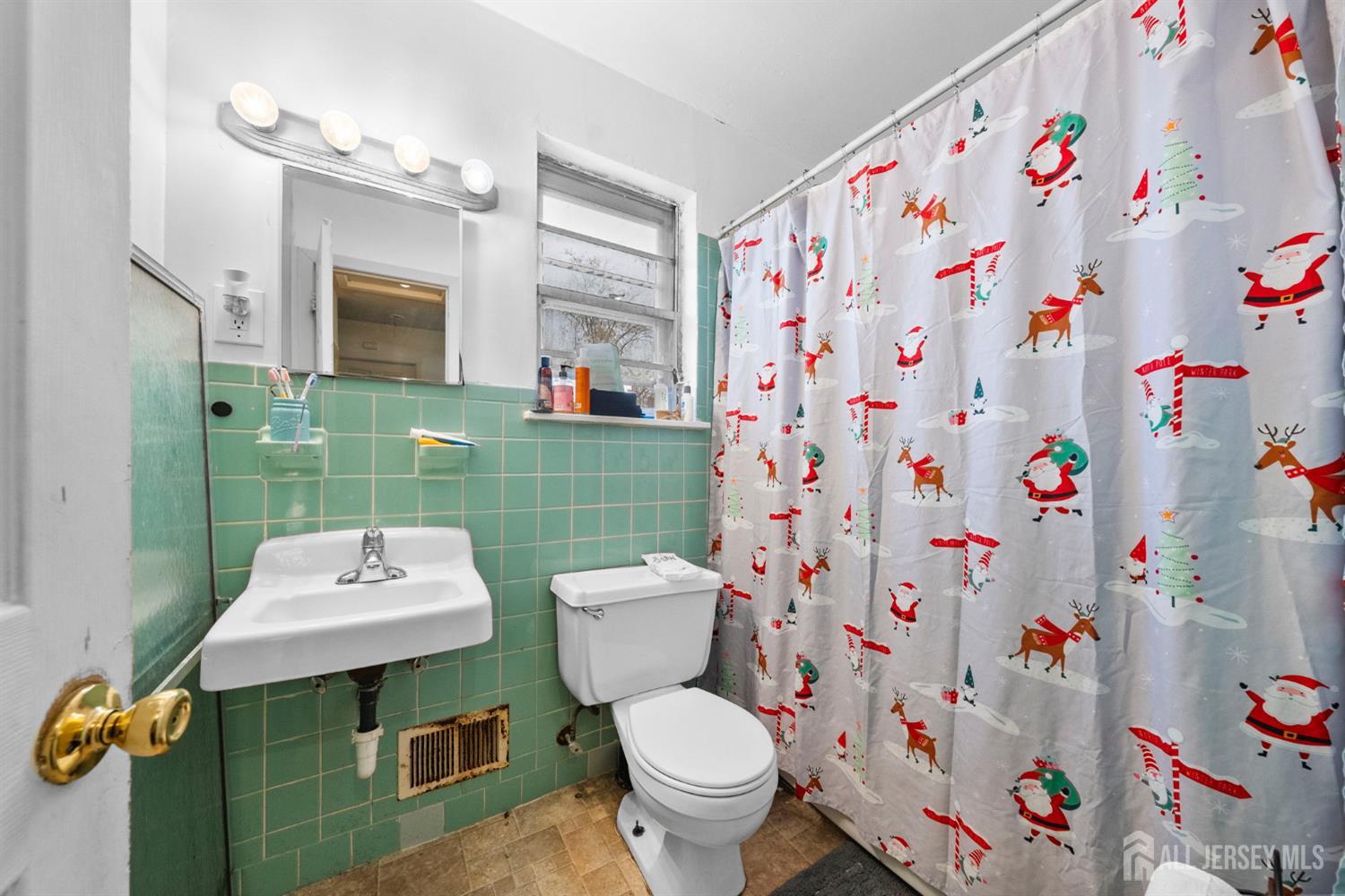 16 Millstone Road Somerset, NJ 08873 - Photo 12 of 35 a bathroom with a sink toilet and a mirror