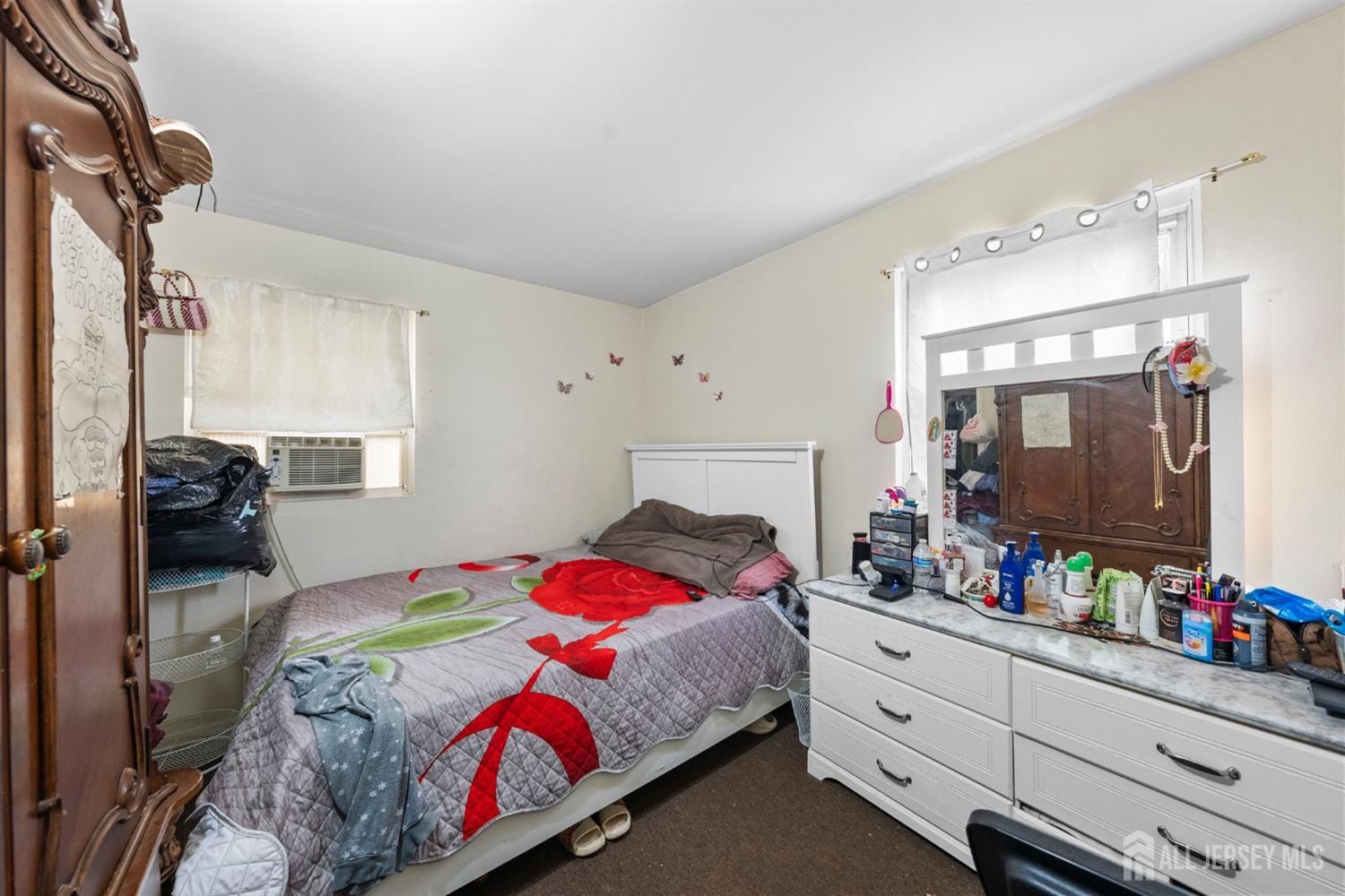 16 Millstone Road Somerset, NJ 08873 - Photo 15 of 35 a bedroom with a bed and a flat tv screen on dresser