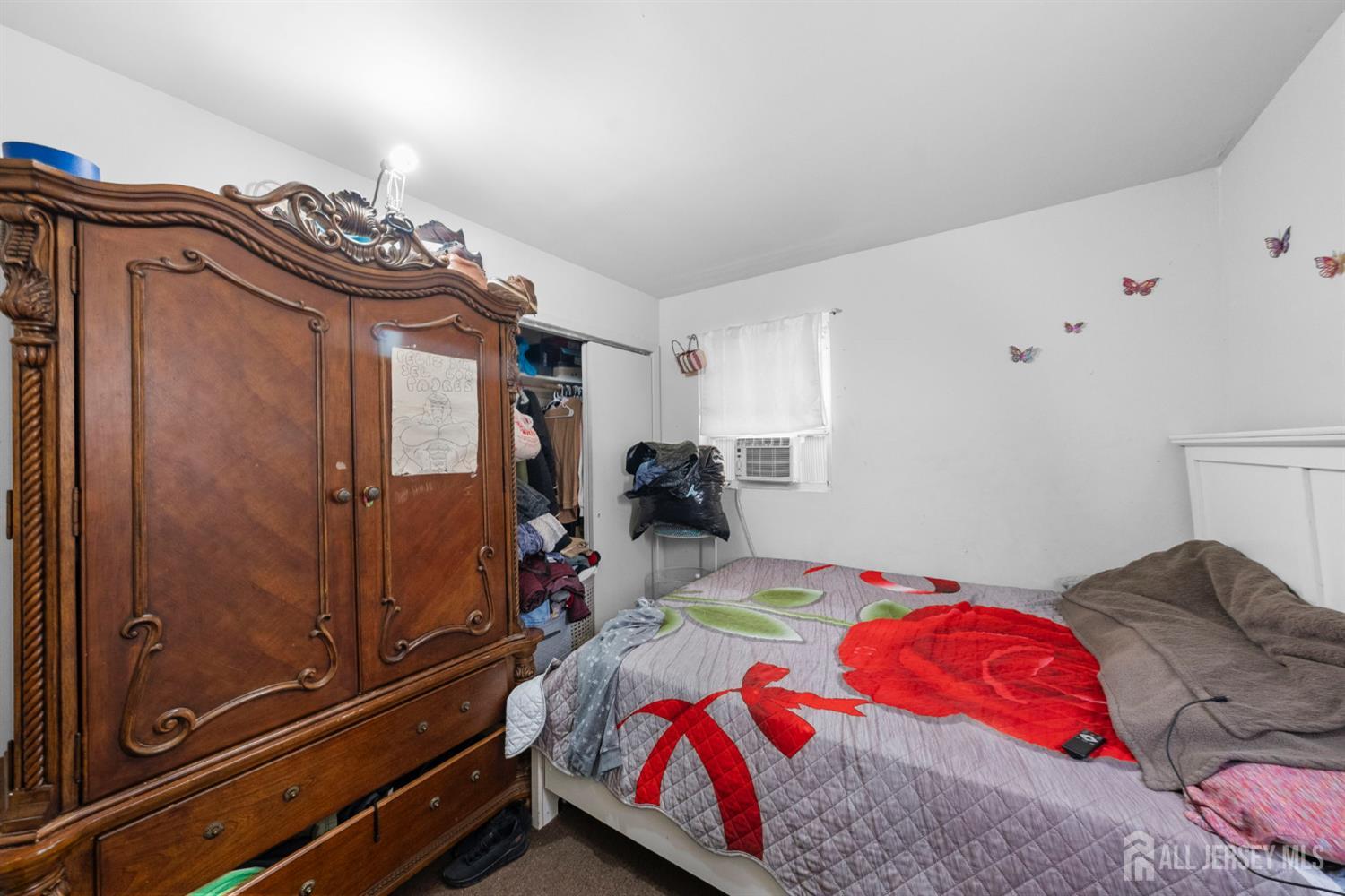 16 Millstone Road Somerset, NJ 08873 - Photo 16 of 35 a bedroom with a bed and a dresser with the shoe rack