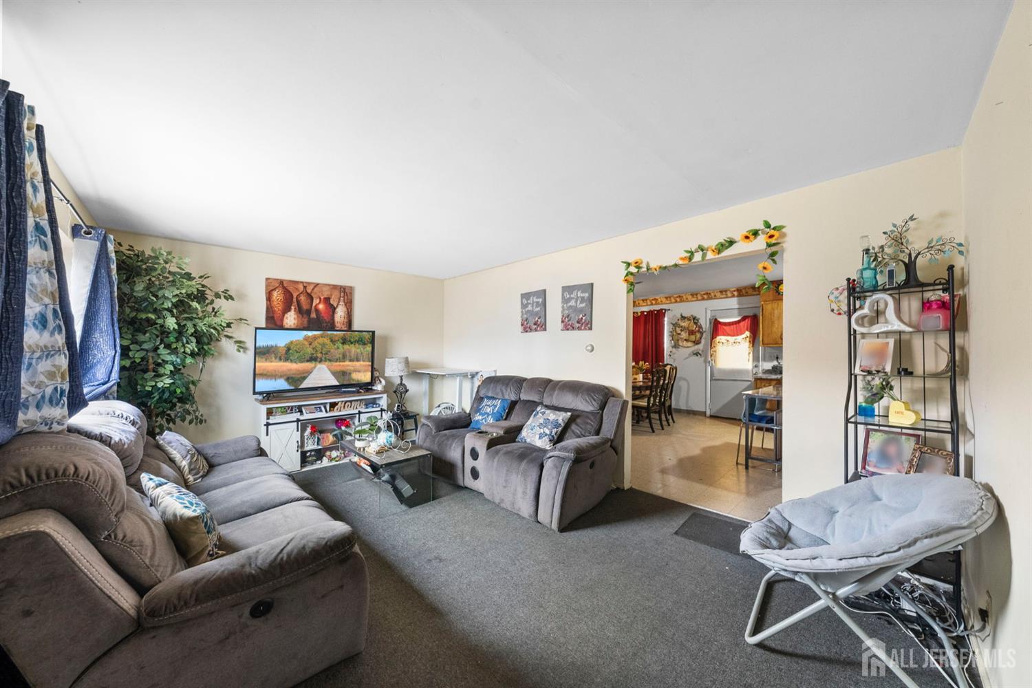 16 Millstone Road Somerset, NJ 08873 - Photo 22 of 35 a living room with furniture and a flat screen tv
