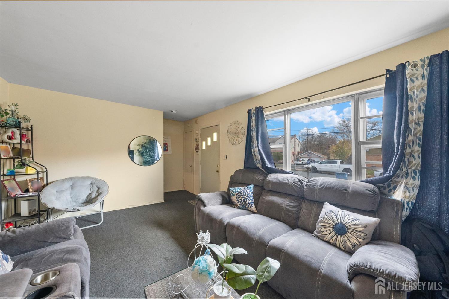 16 Millstone Road Somerset, NJ 08873 - Photo 23 of 35 a living room with furniture and a large window