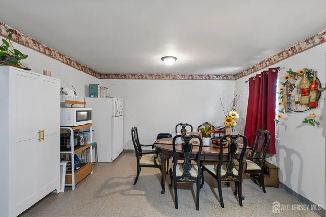 a kitchen with stainless steel appliances a stove a refrigerator and a refrigerator