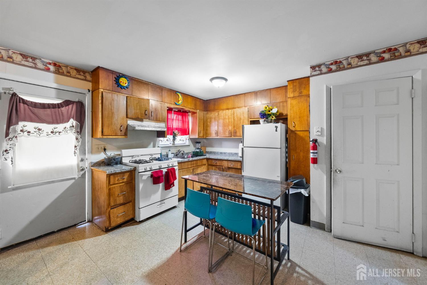 16 Millstone Road Somerset, NJ 08873 - Photo 26 of 35 a kitchen with stainless steel appliances a stove a refrigerator and a refrigerator