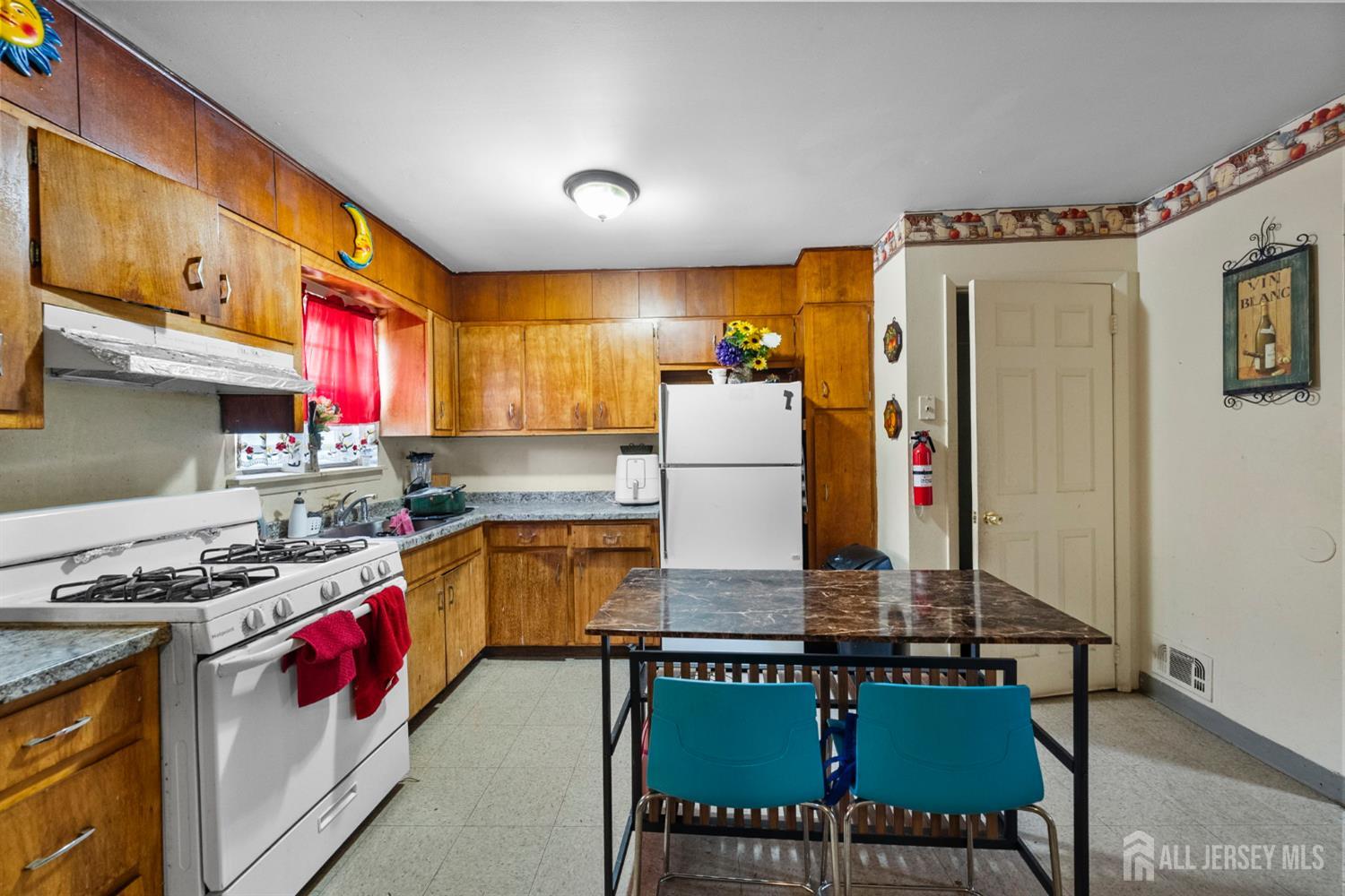 16 Millstone Road Somerset, NJ 08873 - Photo 27 of 35 a kitchen with stainless steel appliances granite countertop a stove and a refrigerator