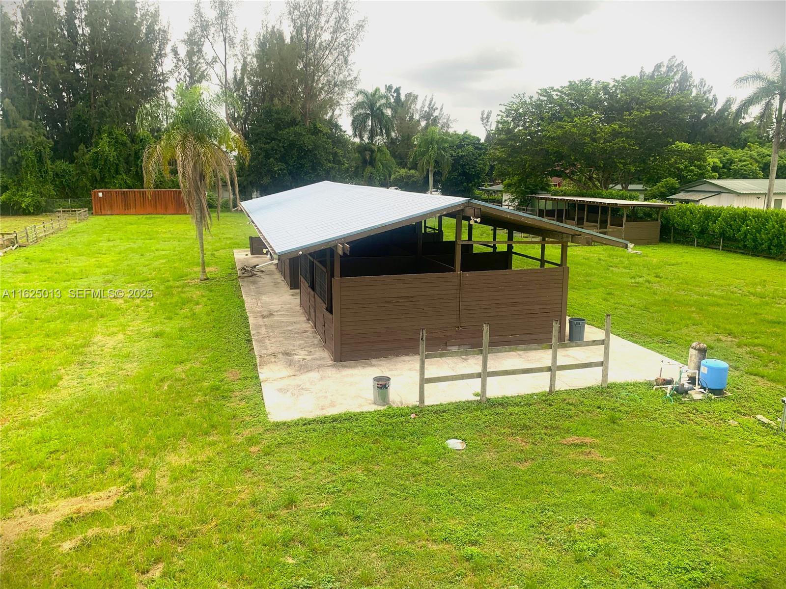 22750 Southwest 154th Avenue Miami, FL 33170 - Photo 11 of 37 a view of a house with a yard and sitting area