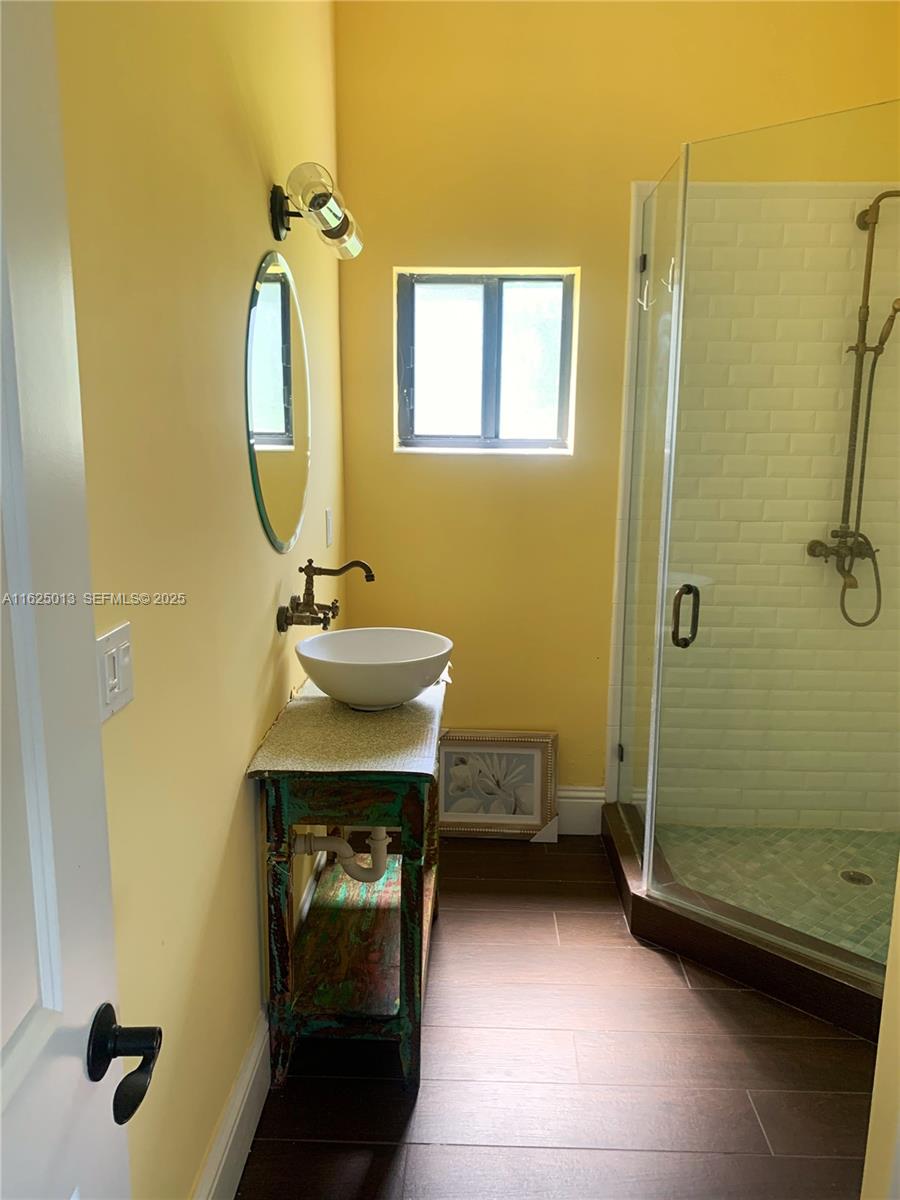 22750 Southwest 154th Avenue Miami, FL 33170 - Photo 16 of 37 a bathroom with a sink mirror and toilet