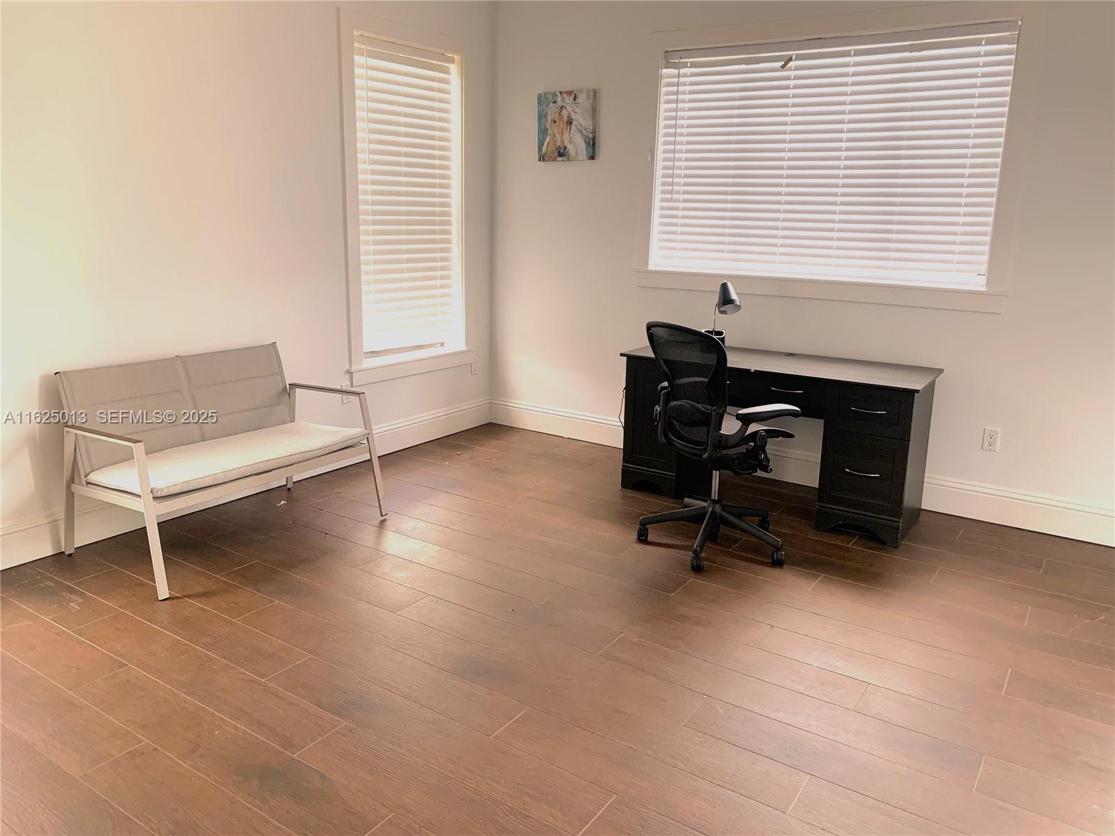 22750 Southwest 154th Avenue Miami, FL 33170 - Photo 23 of 37 a view of a workspace with a window and a chair