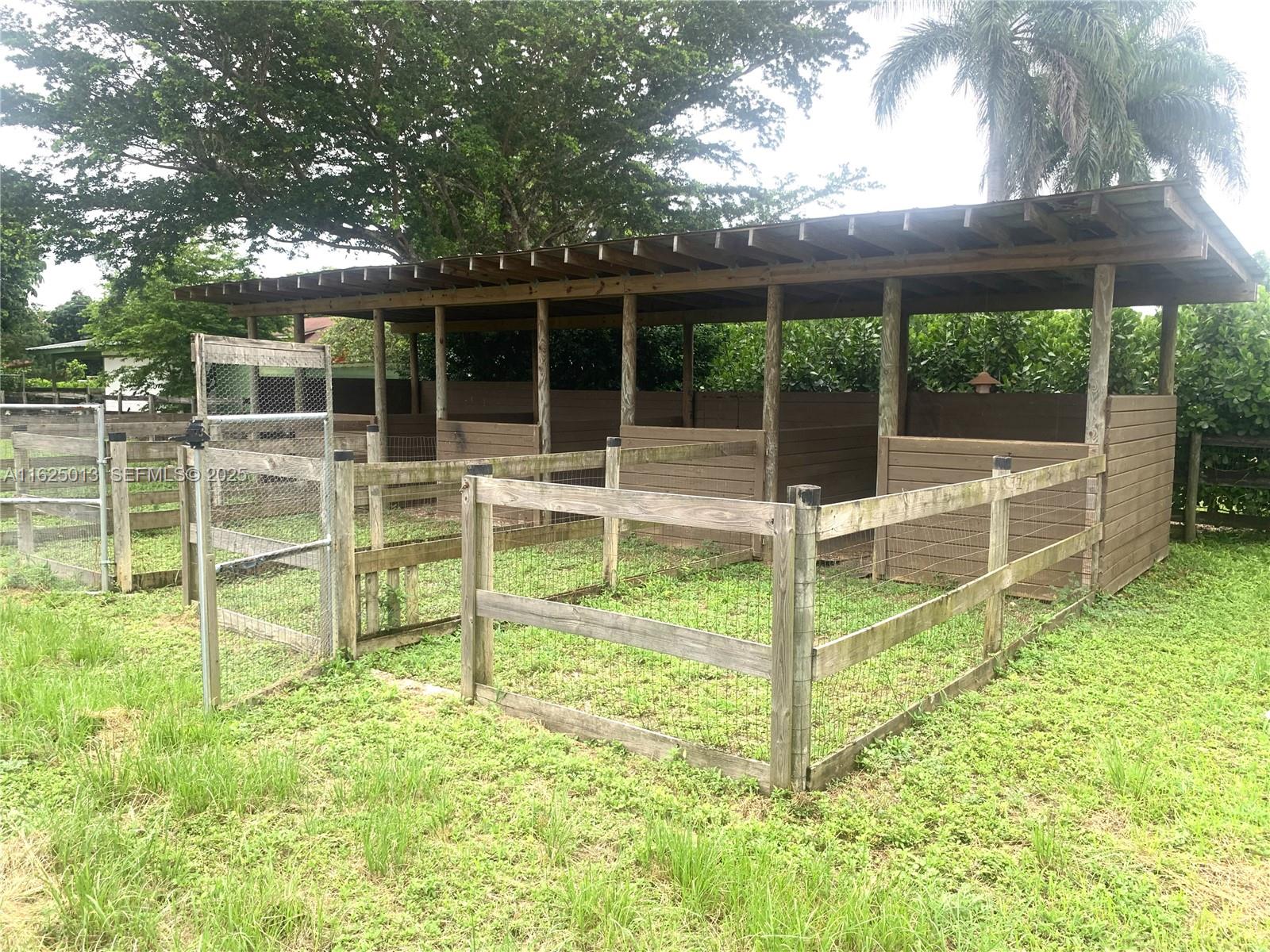 22750 Southwest 154th Avenue Miami, FL 33170 - Photo 30 of 37 a view of a house with a backyard
