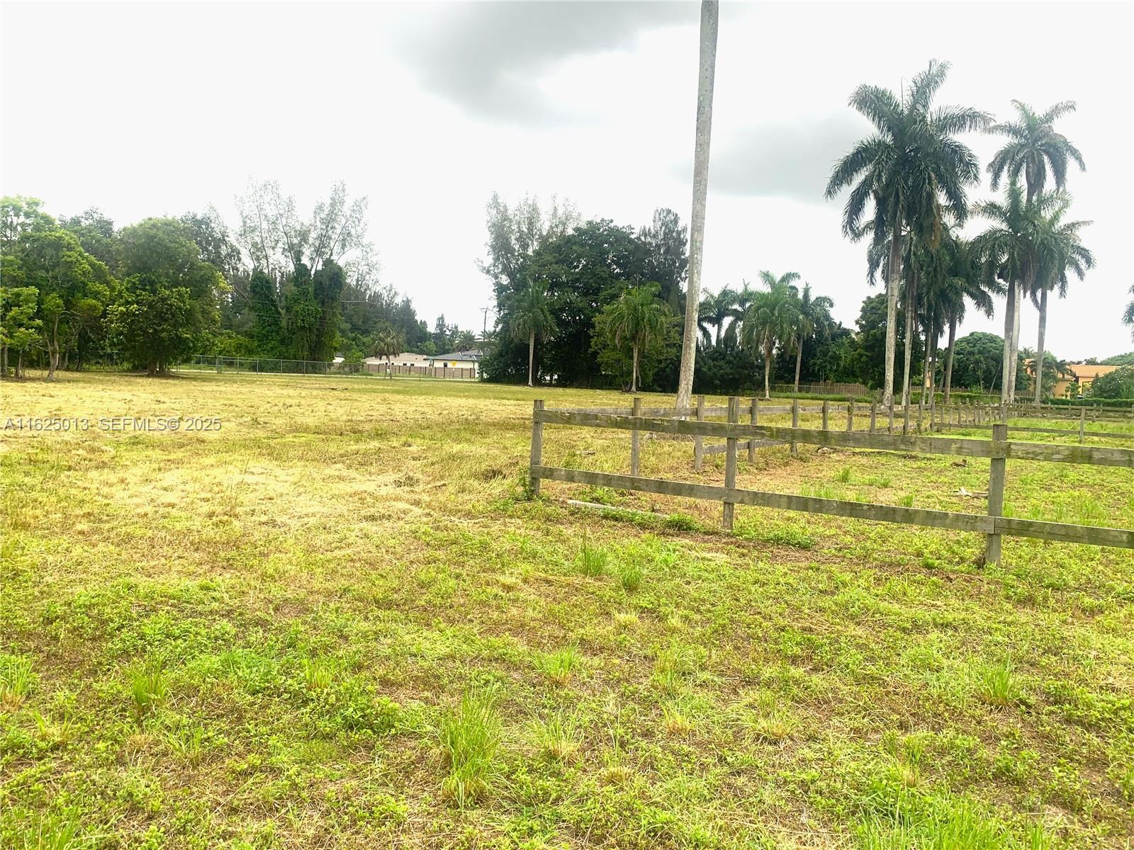 22750 Southwest 154th Avenue Miami, FL 33170 - Photo 32 of 37 a view of a swimming pool with a yard