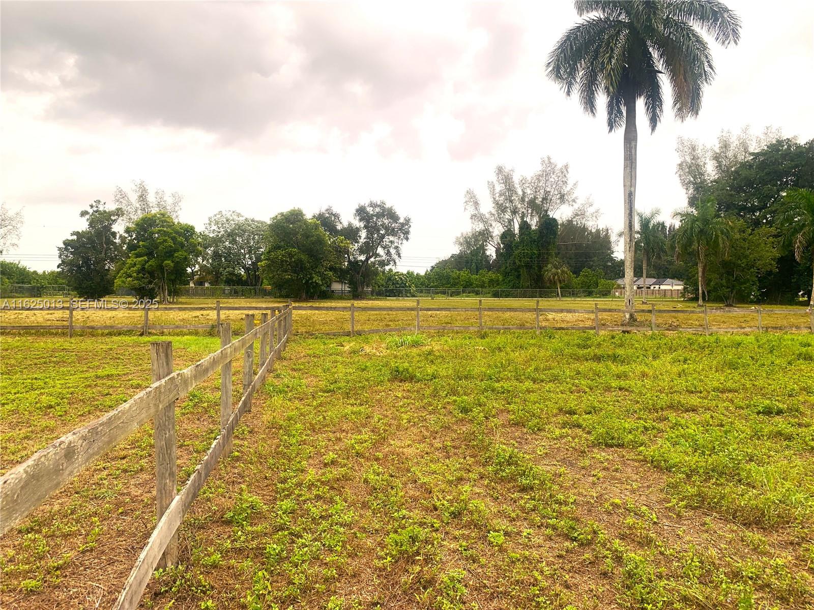 22750 Southwest 154th Avenue Miami, FL 33170 - Photo 34 of 37 a view of a swimming pool and a yard