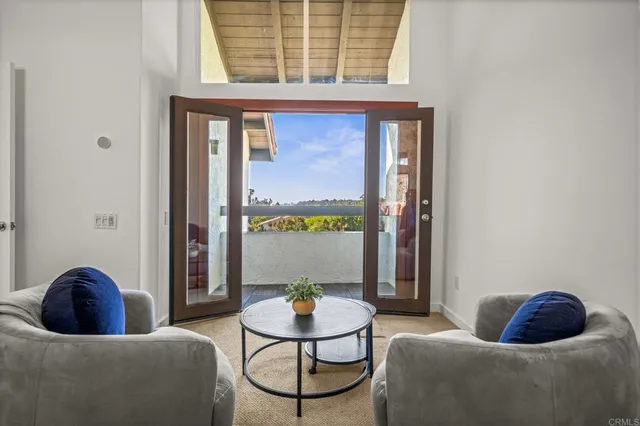 a bathroom with a granite countertop sink mirror and bathtub