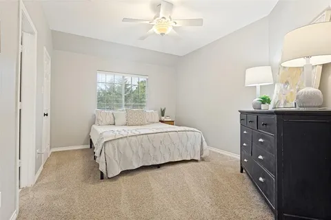 a bed room with a bed and a window