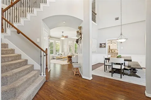 a view of a livingroom with furniture and hardwood floor