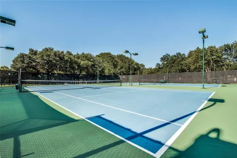 a view of an outdoor space and tennis court