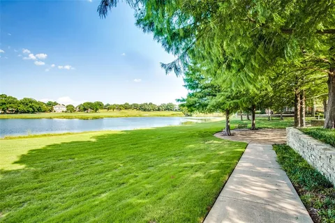a view of a lake with a garden