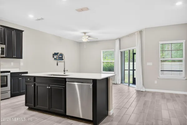 a kitchen with a sink and cabinets