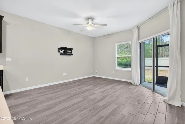 a view of an empty room with a window