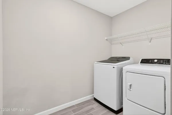 a utility room with dryer and washer