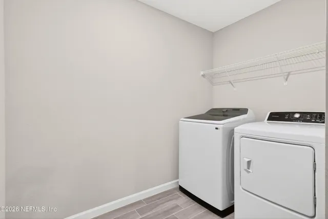 a utility room with dryer and washer