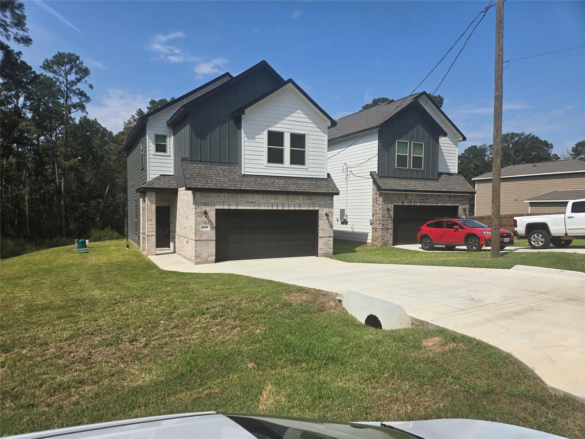 0 Berry Lane Conroe, TX 77302 - Photo 4 of 6 a front view of a house with garage
