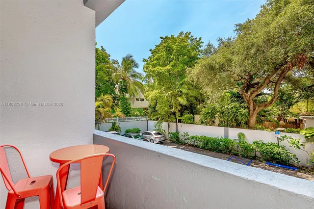 a view of a balcony with chairs