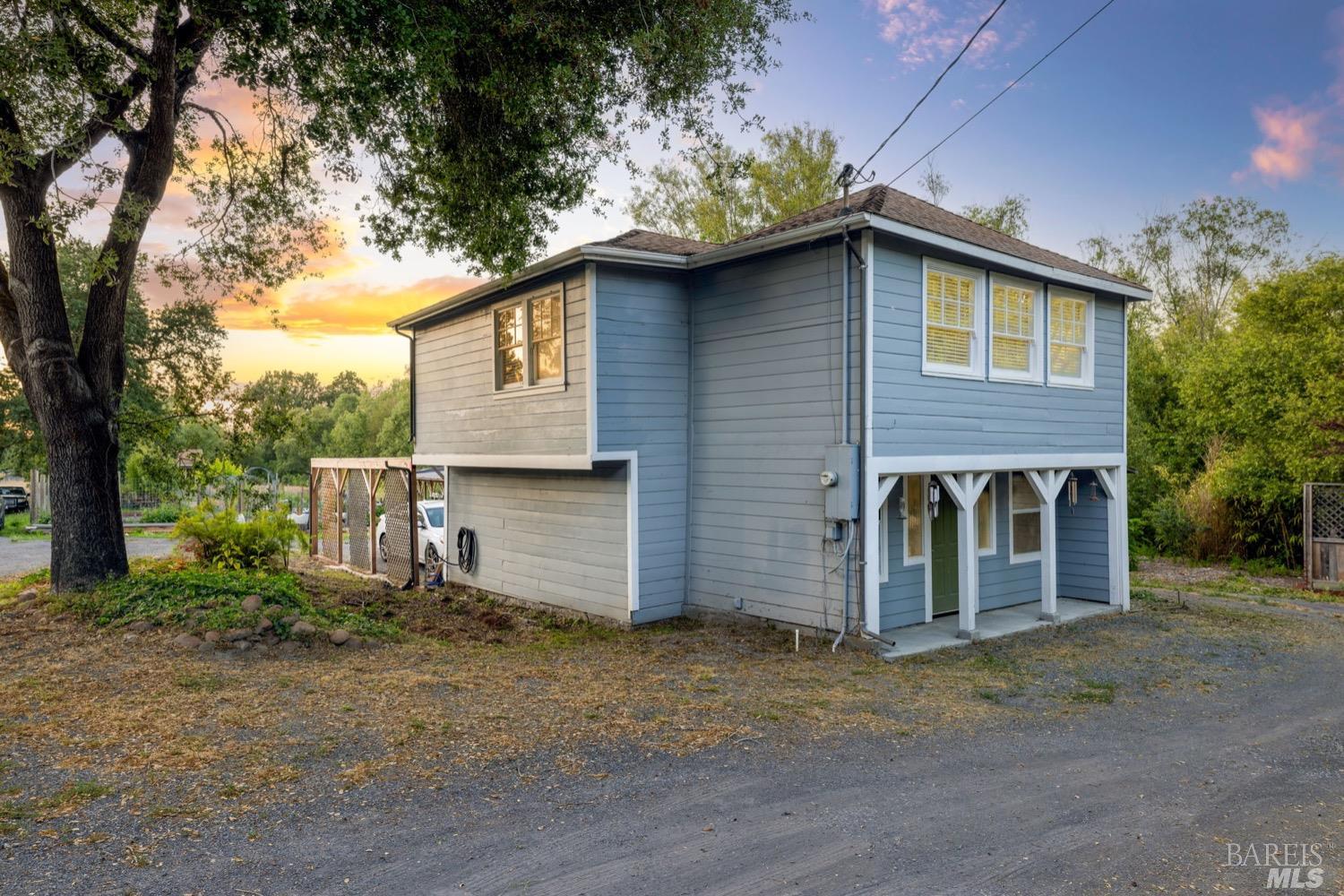 a view of a house with a yard