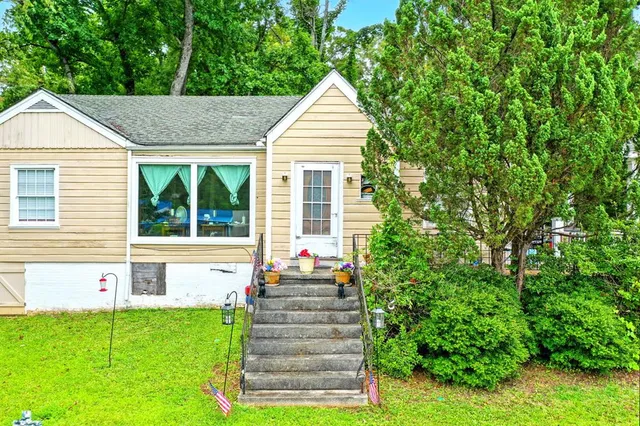 a house view with a garden space