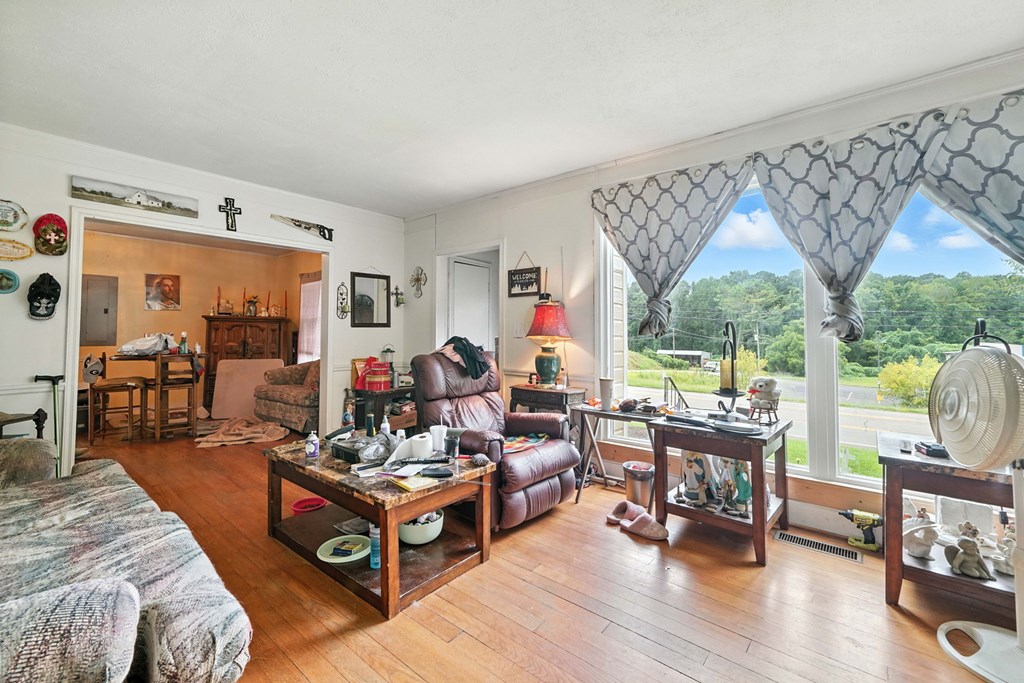 1003 East Church Street Jasper, GA 30143 - Photo 11 of 27 a living room with furniture and a large window