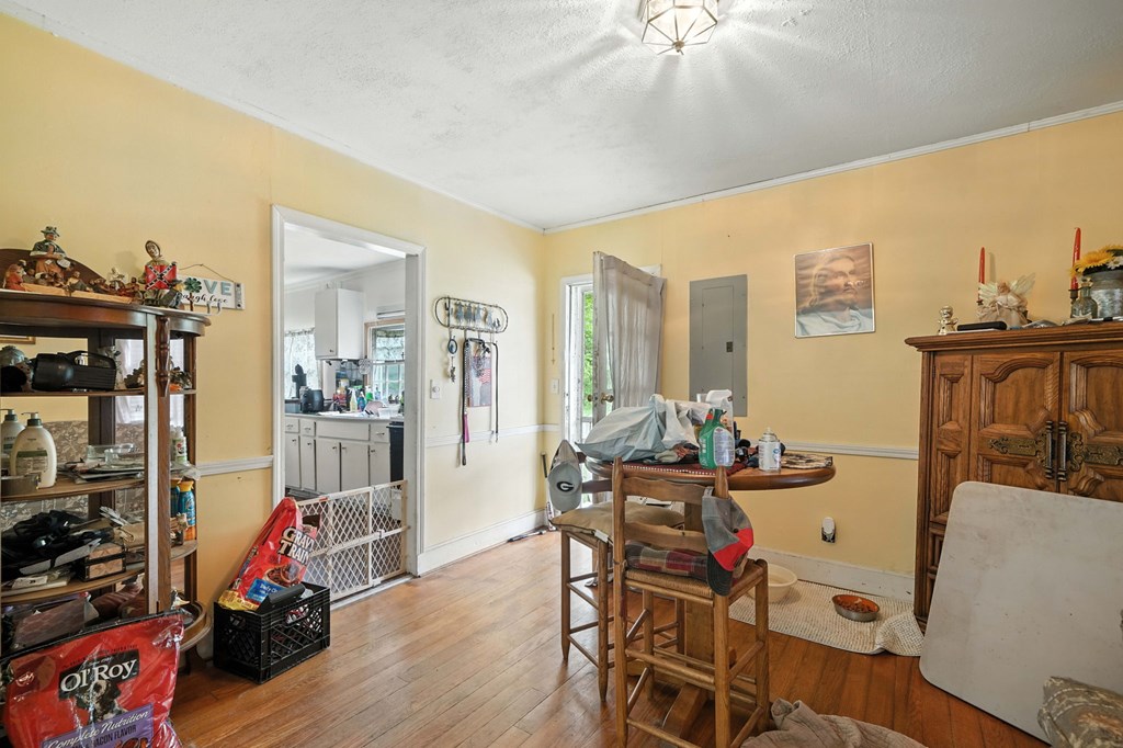 1003 East Church Street Jasper, GA 30143 - Photo 13 of 27 a living room with furniture a wooden floor and next to a window