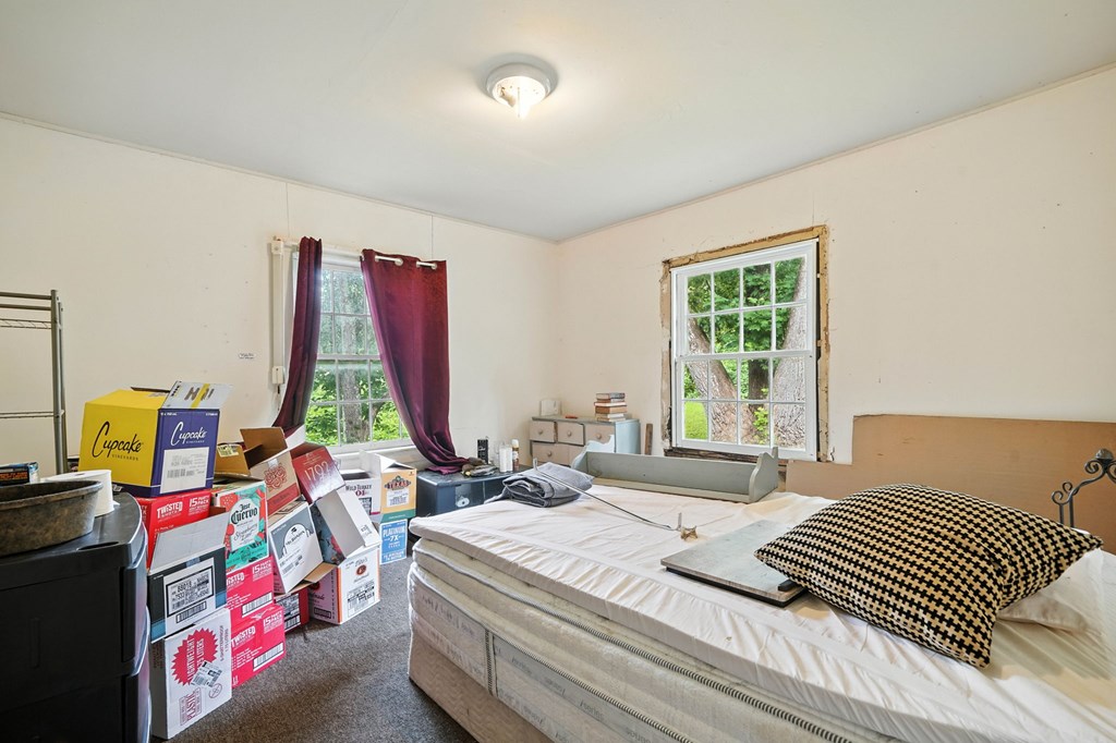 1003 East Church Street Jasper, GA 30143 - Photo 18 of 27 a bedroom with a bed and a window