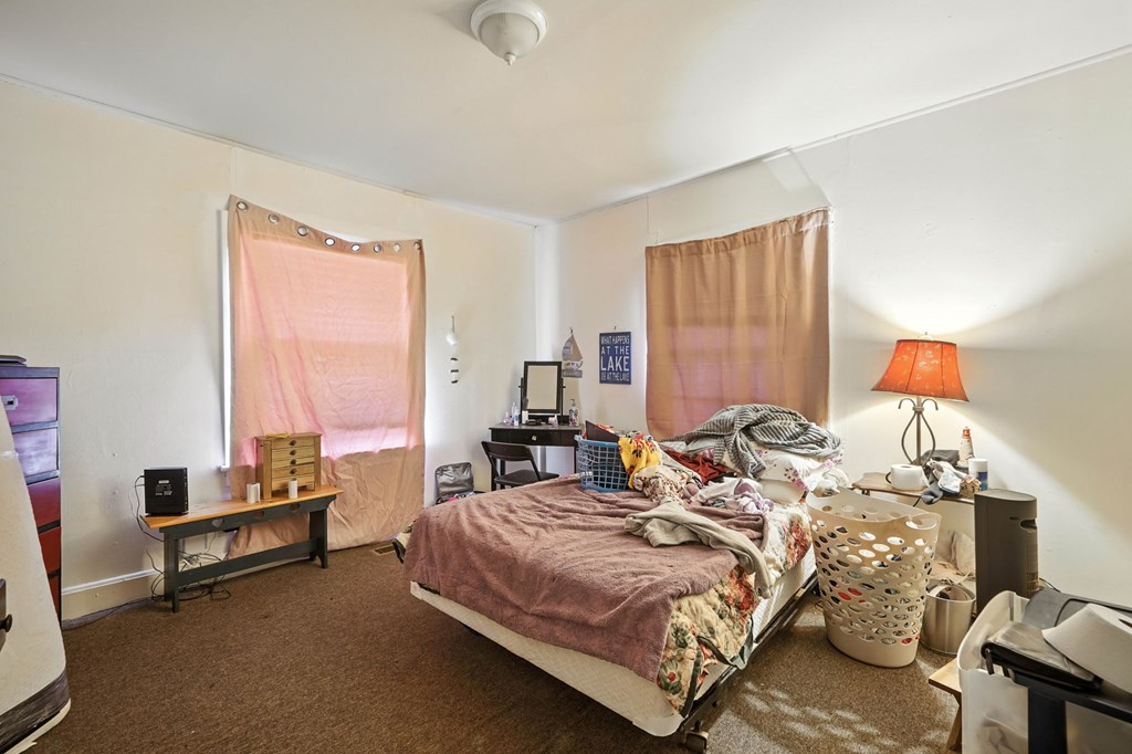 1003 East Church Street Jasper, GA 30143 - Photo 20 of 27 a bedroom with two beds and a couch